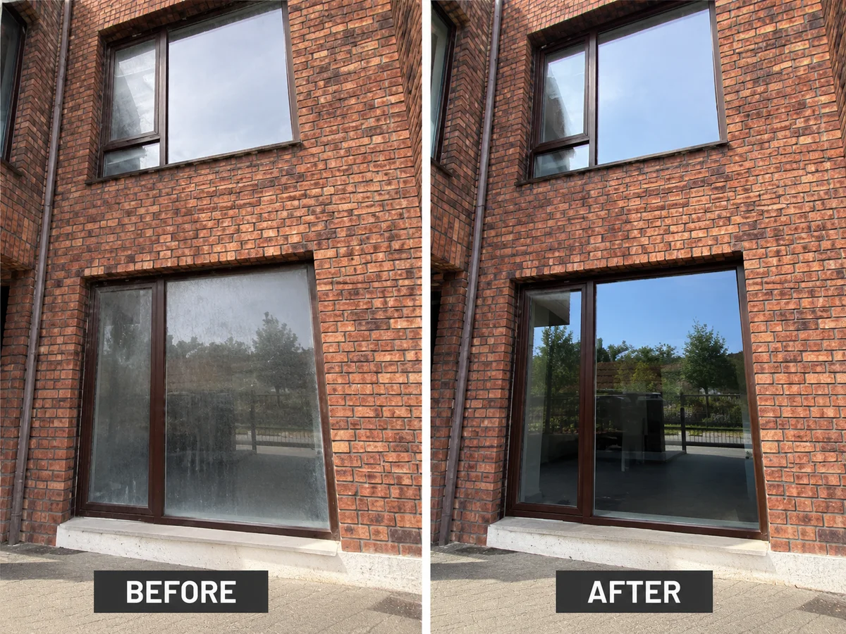 Before and after office glass cleaning on a brick commercial building